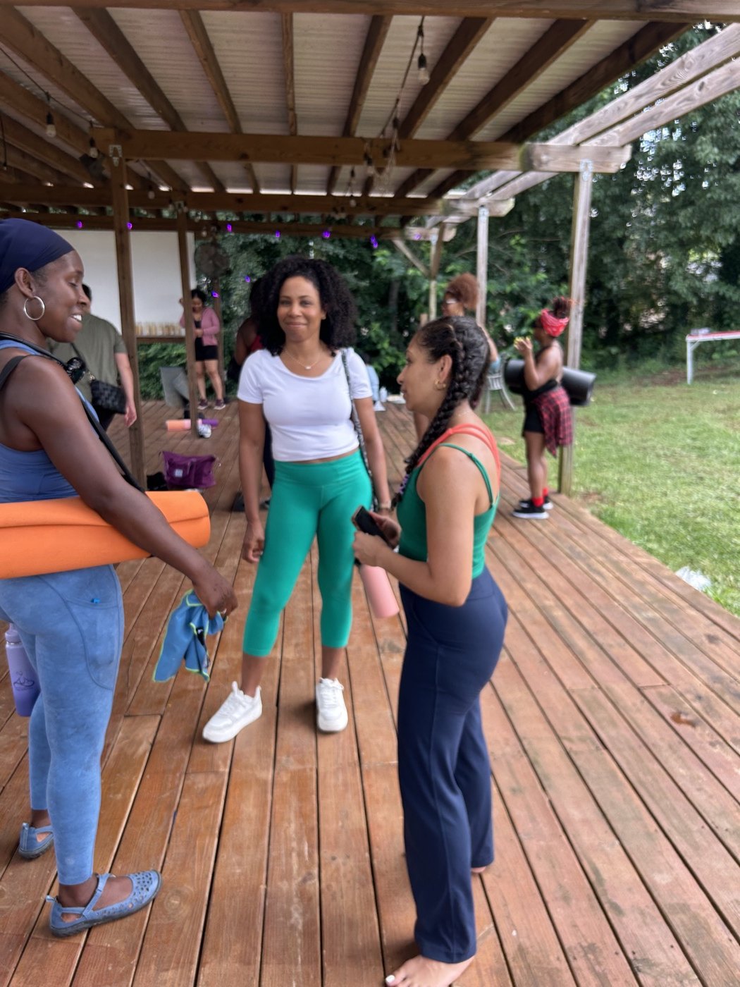 Community members gathered together on the farm deck